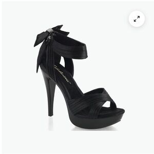 Black platform Fabulicious heels with a bow